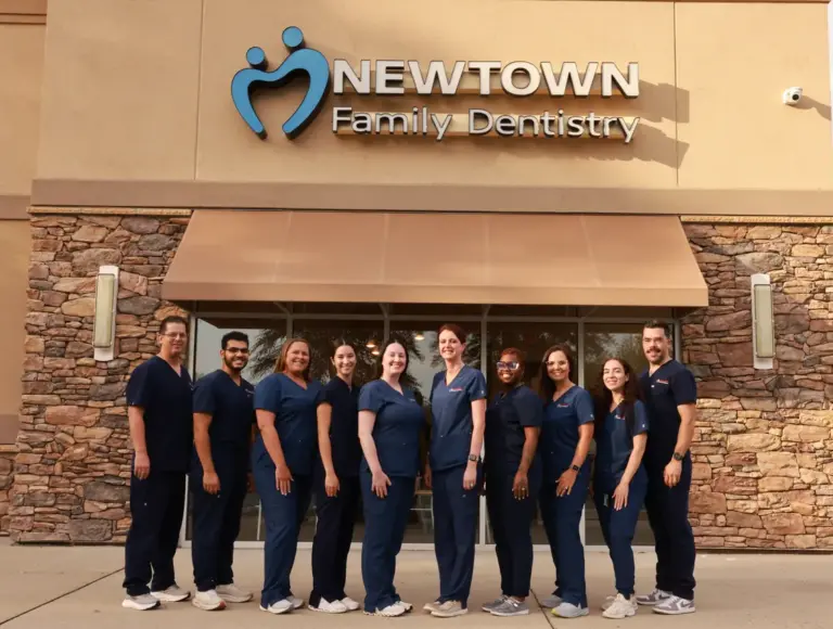 Newtown Family Dentistry Team standing in front of the office building